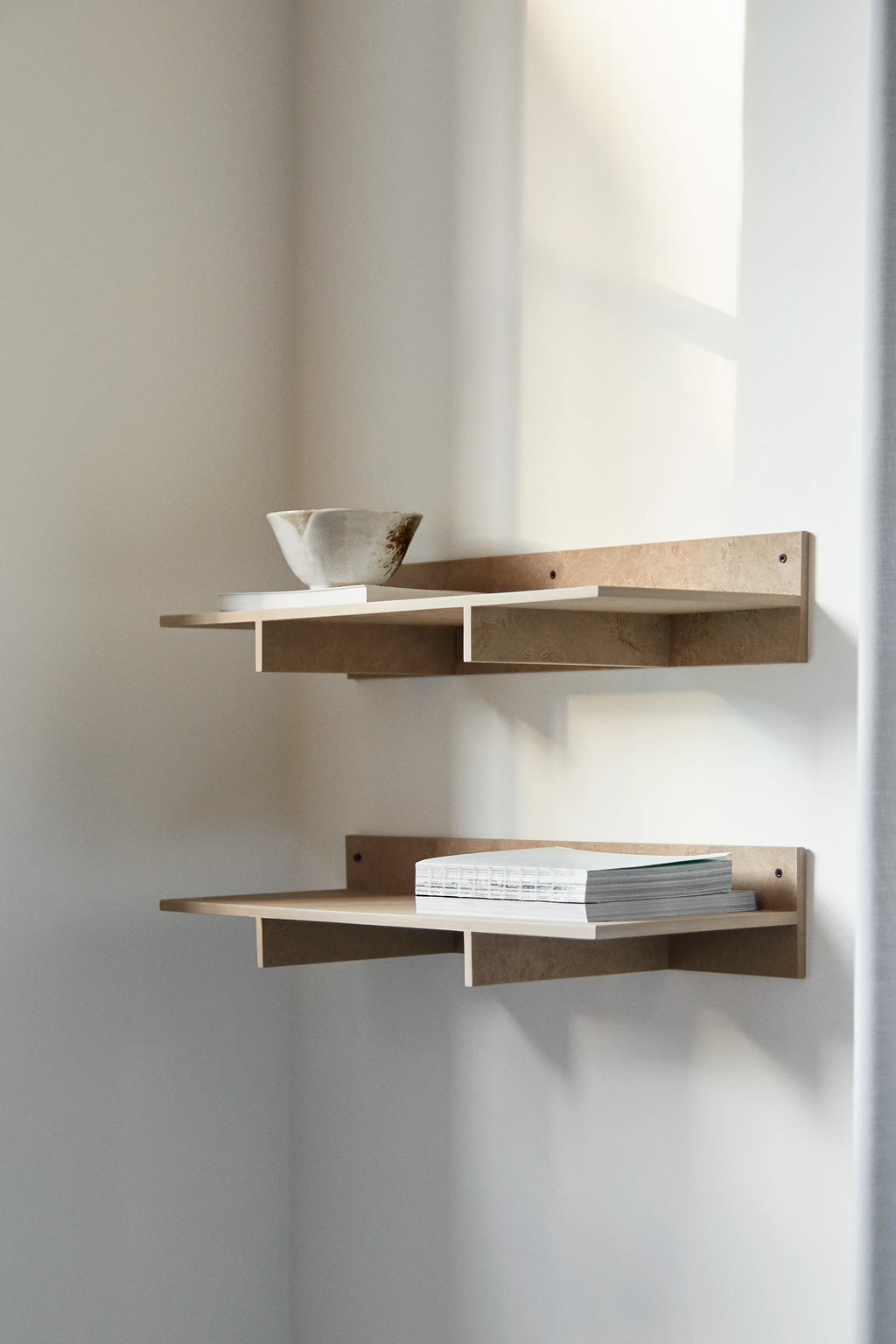 Mater Edge Shelf in light natural wood finish, a modern and minimalist wall-mounted shelving unit, shown in a lifestyle setting with decorative bowl and books, creating a stylish storage solution.