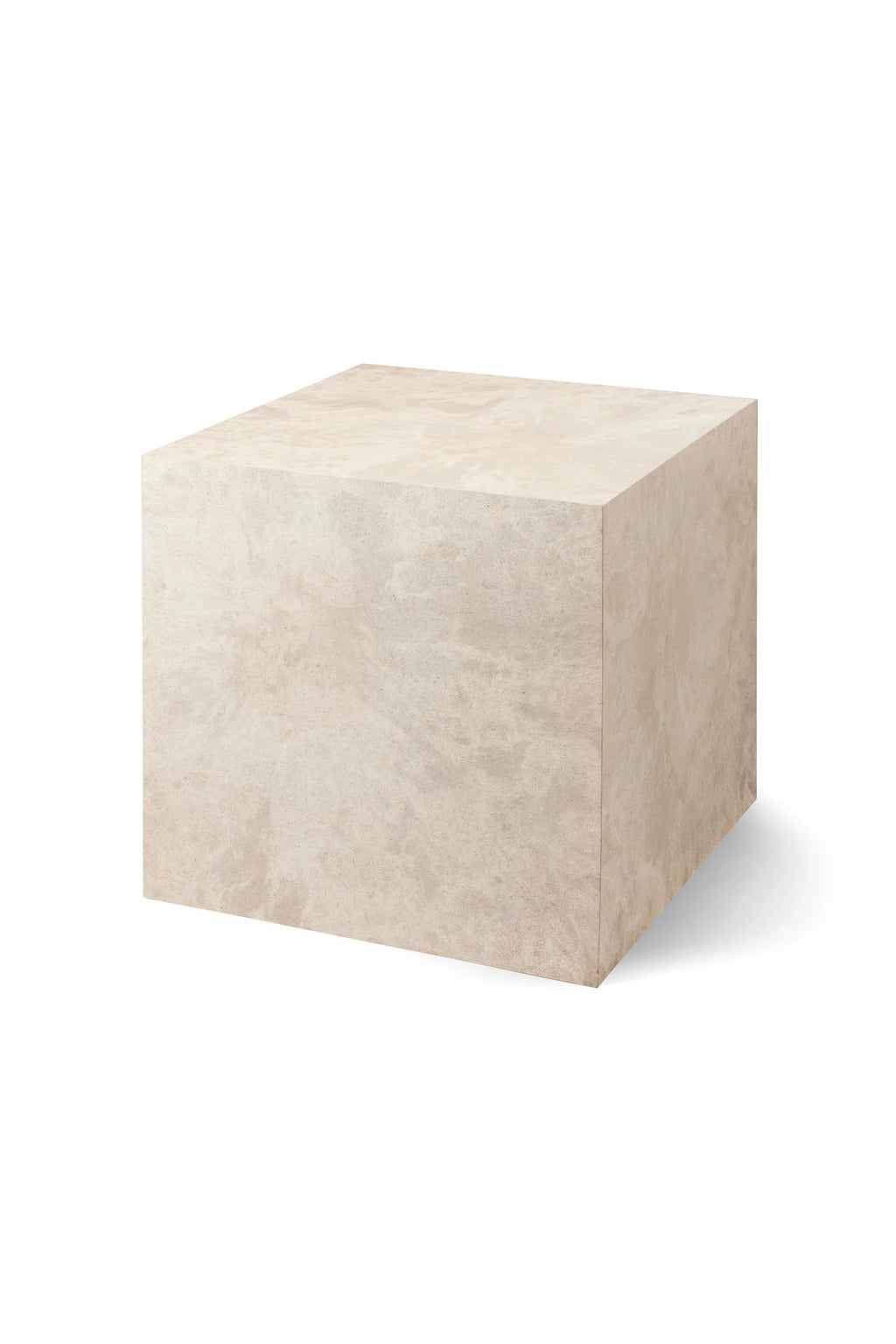 Mater Cube, a single cream-colored cube-shaped side table, showcasing its elegant, understated marbled texture and minimalist design, casting a gentle shadow on a white background.