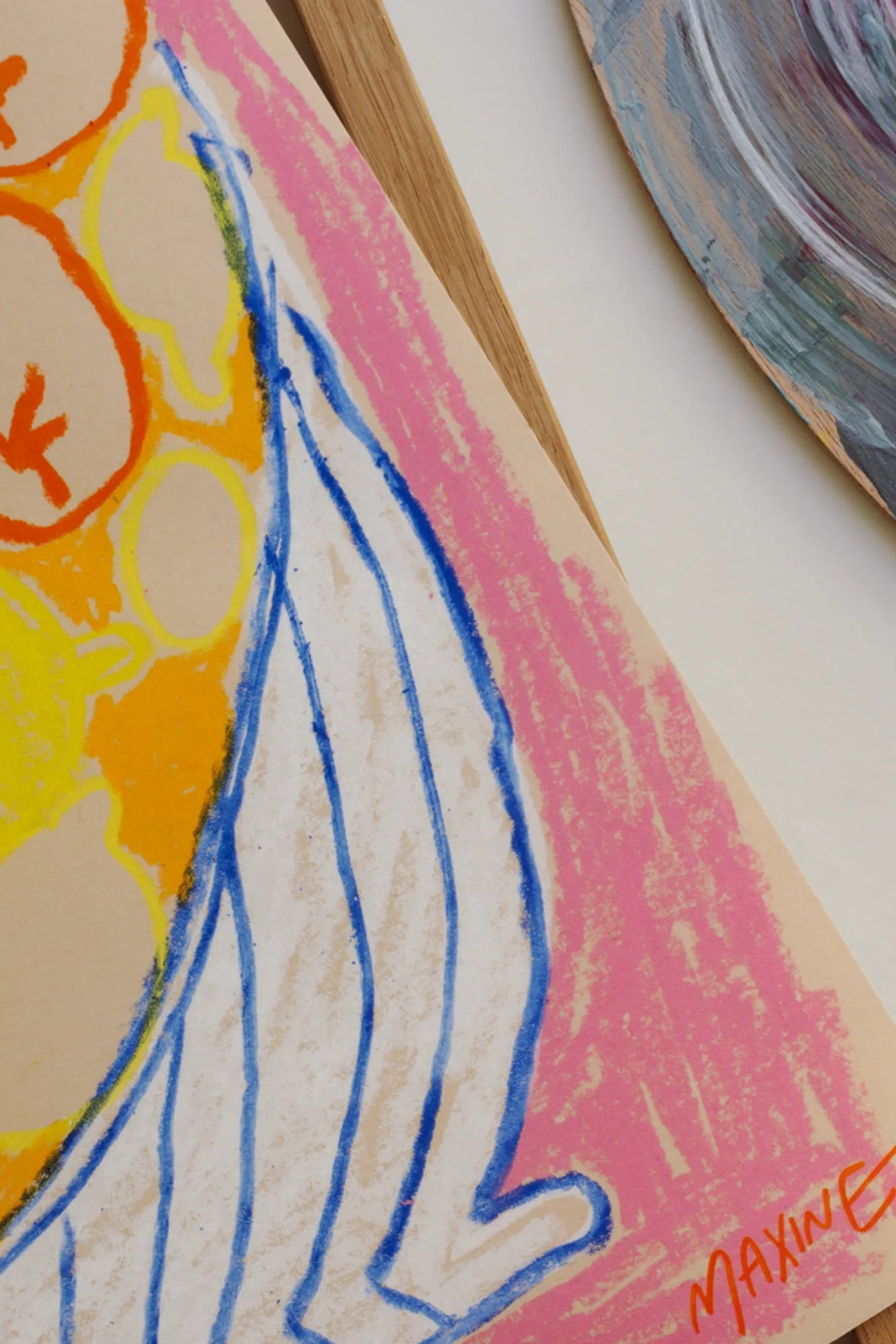 A modern ceramic fruit bowl with an assortment of ripe fruits on a stylish pink table