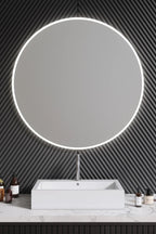 Circular mirror with built-in lights for a stylish bedroom decor