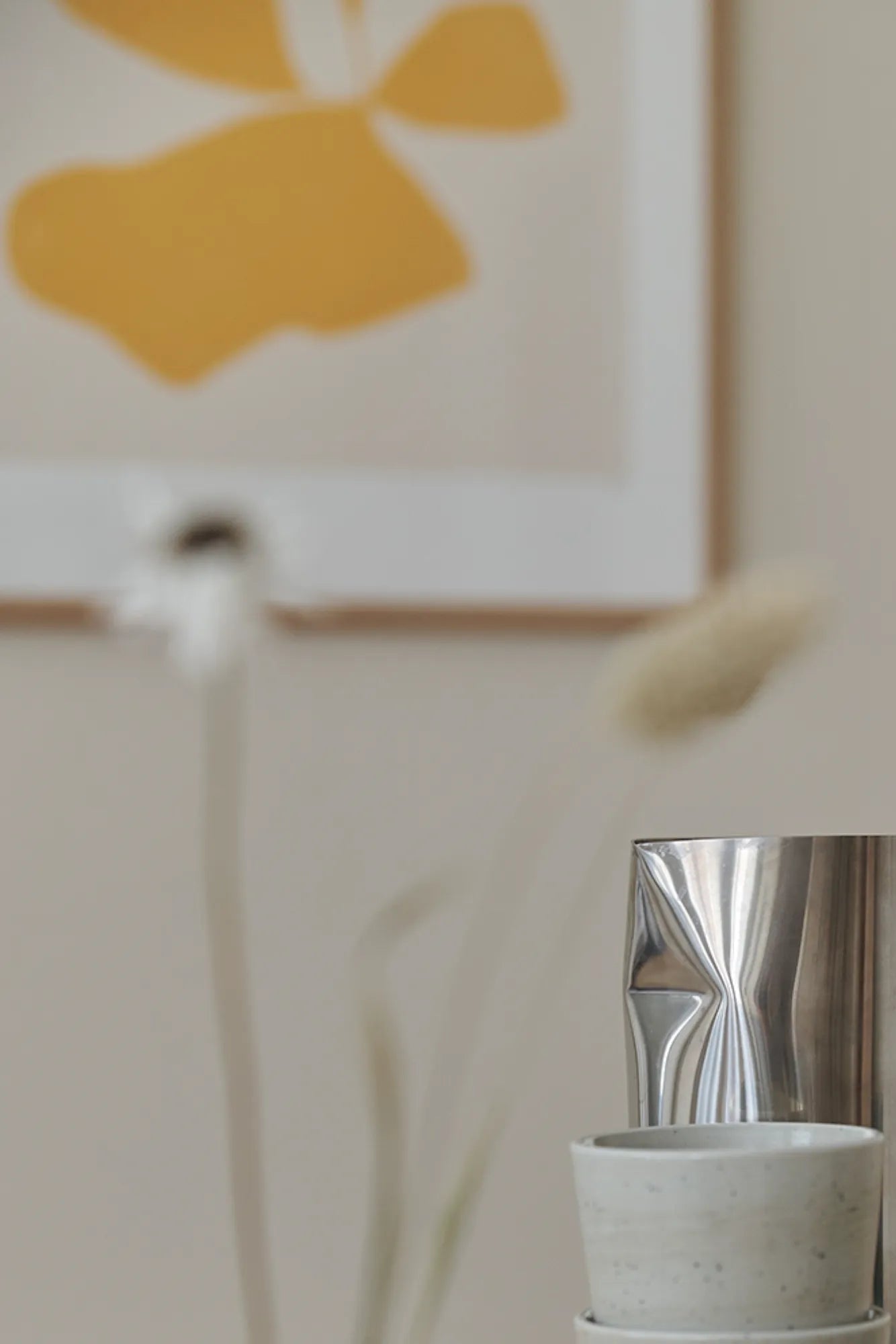 A group of Botanik III plants arranged on a wooden shelf in a well-lit room