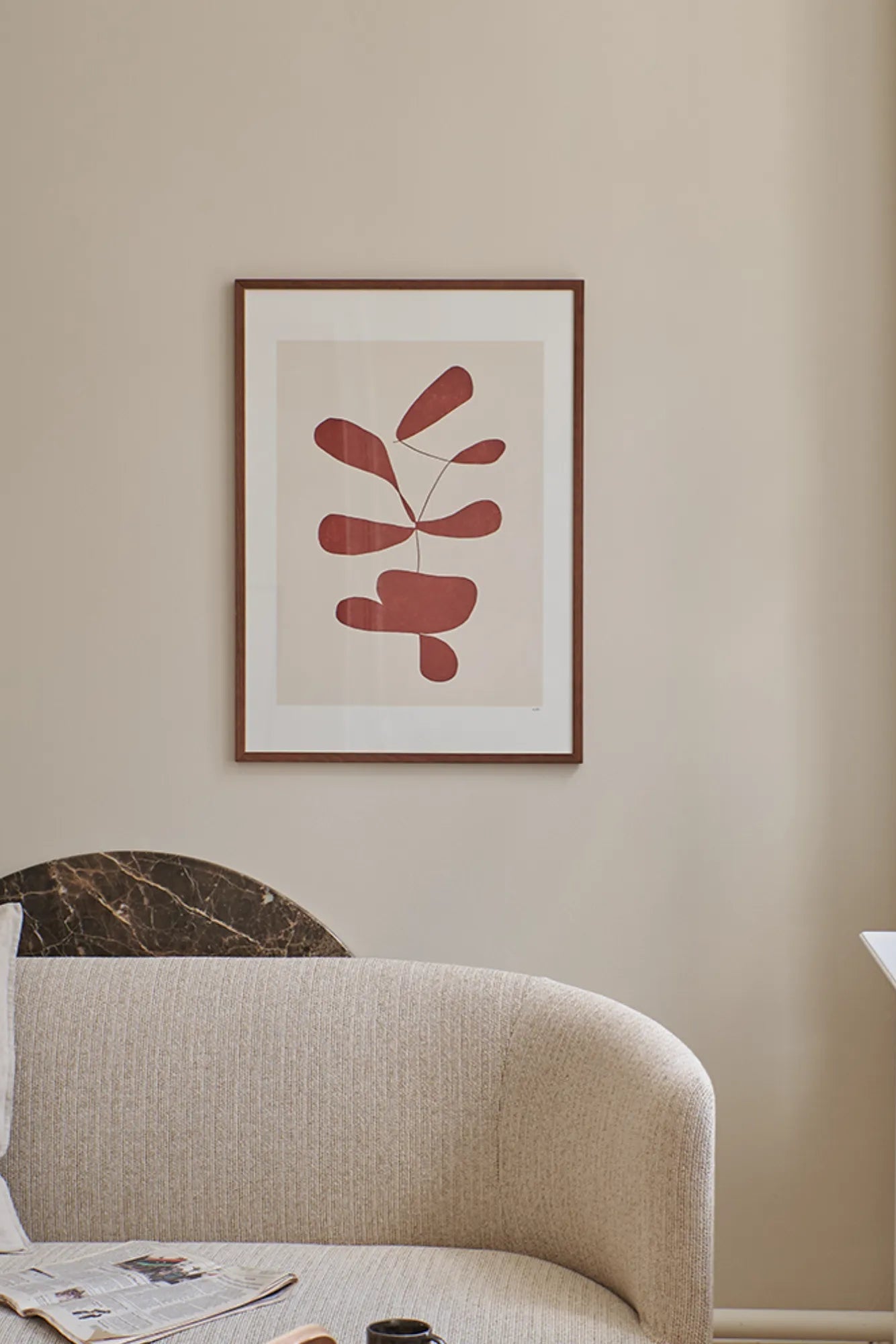 Close-up of Botanik I bottle filled with natural ingredients and surrounded by fresh flowers