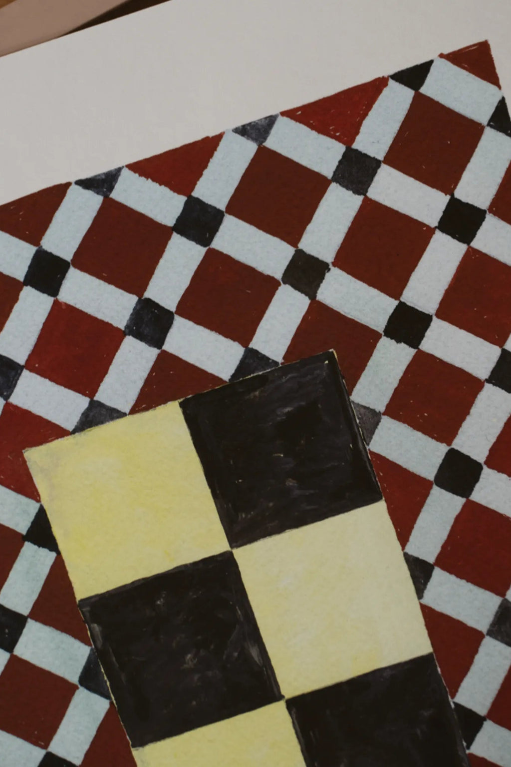 The Poster Club Tern No. 7, an abstract geometric art print featuring two overlapping diagonal checkerboard patterns with a painterly texture. The larger pattern showcases deep red, light blue, and black squares, while the smaller, foreground pattern displays pale yellow and black squares, creating a retro post-modern aesthetic.