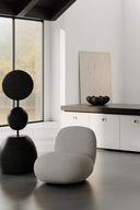 Modern and comfortable flat toe lounge chair in sleek black leather 