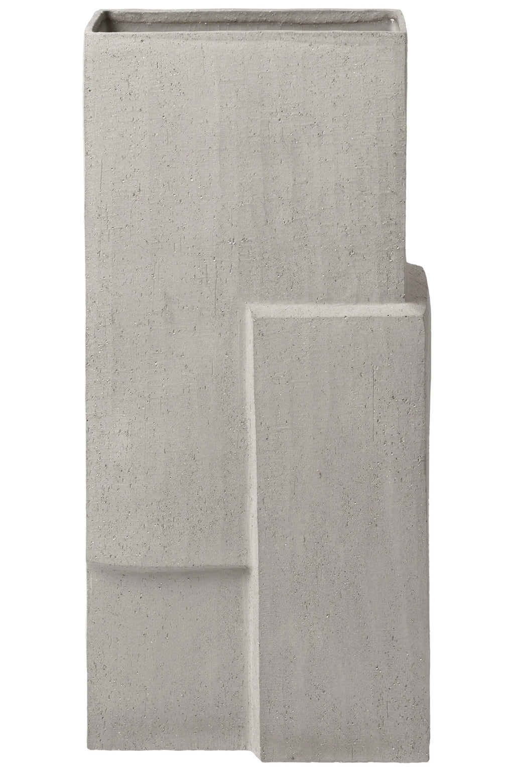 Kristina Dam Monolith Vase, a tall, rectangular light grey concrete vase with a rough, textured, speckled finish and bold geometric, brutalist design featuring stepped architectural details. Perfect as a sculptural minimalist decorative object for modern living rooms, industrial chic spaces, or contemporary shelf styling.