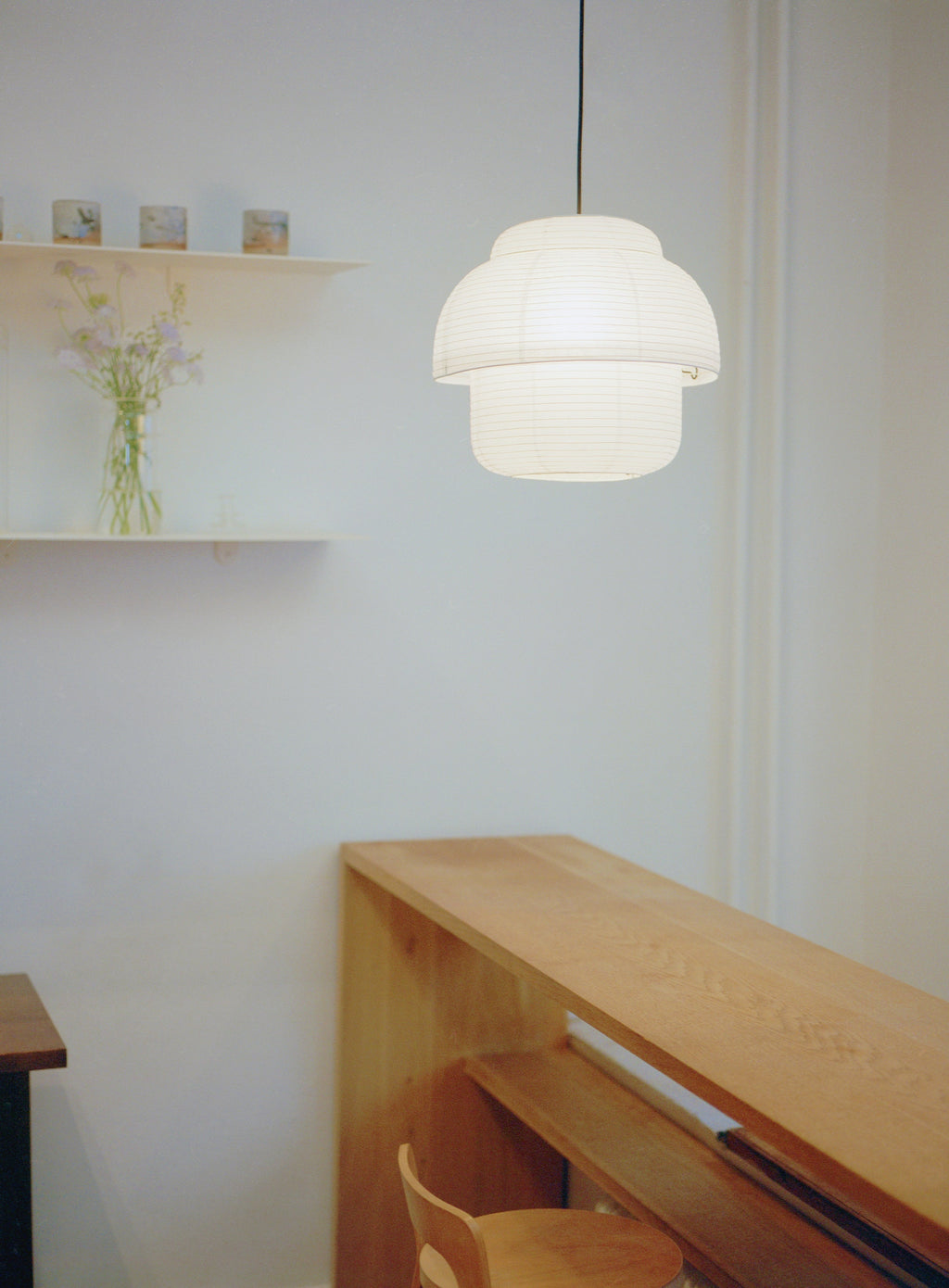 Made by Hand Papier Double Ø40 Pendant Lamp, an off-white double-tiered paper lantern pendant light featuring a distinctive stacked, organic silhouette crafted from delicate rice paper with a subtle ribbed texture. This minimalist and contemporary ceiling light casts a soft, diffused glow, ideal for creating a serene ambiance in japandi, Scandinavian, or organic modern living rooms and dining areas.