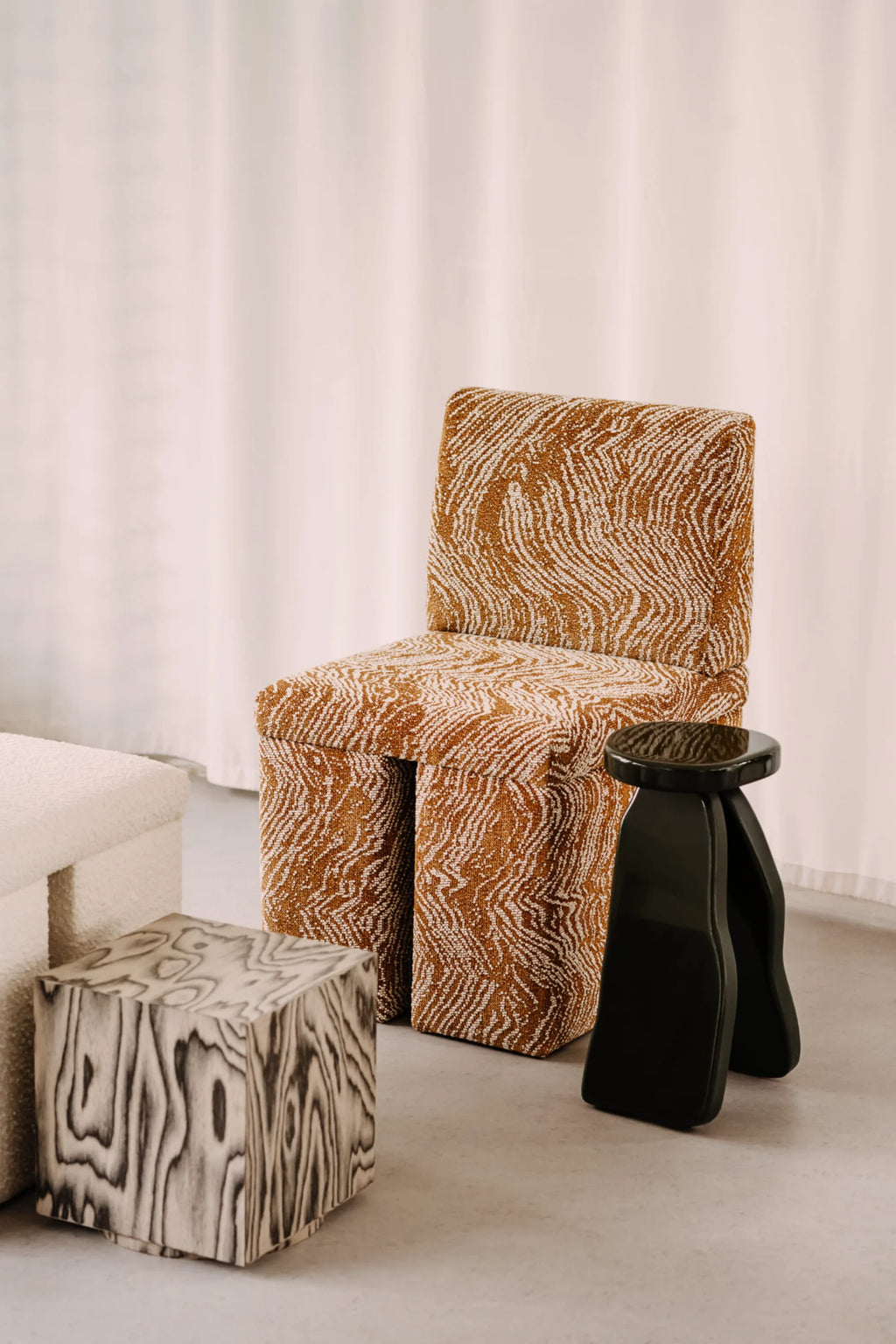 NG DESIGN Object 107 Side Table, a luxury square block in light gray wood with distinctive dark grain patterns, displayed on a concrete floor. Ideal for contemporary decor.
