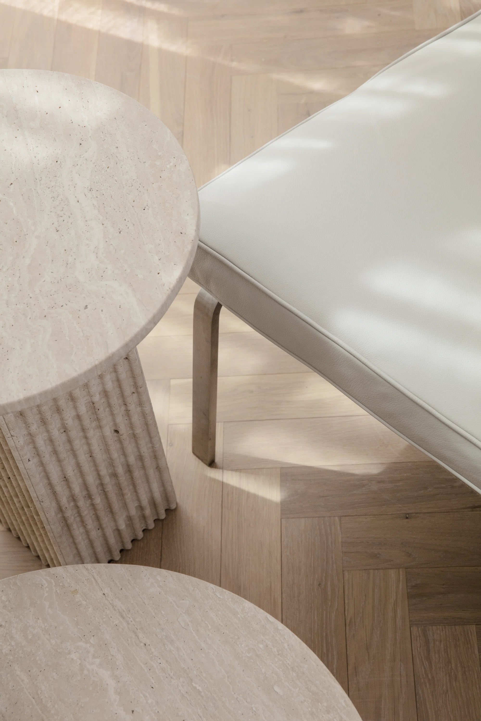 Round stools with textured surfaces on a wooden floor