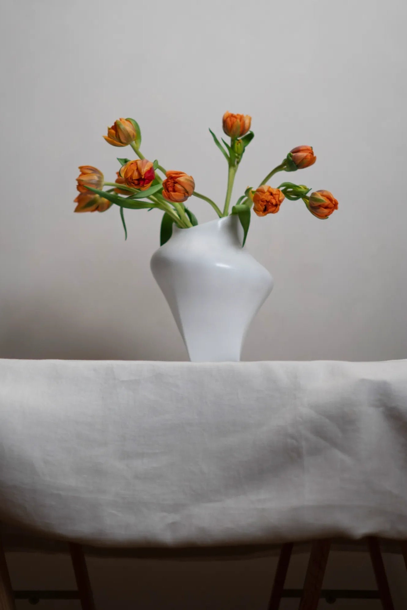 Nami Vase displayed on a wooden shelf with natural lighting