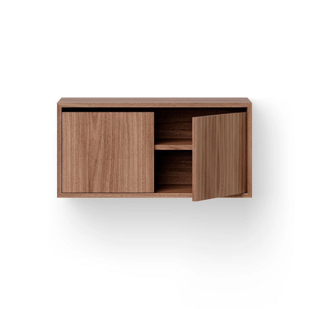 Modern wooden low cabinet with white doors and sleek metal handles