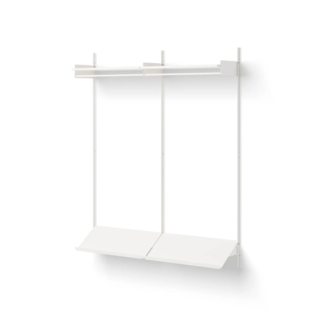 New Works Wardrobe Shelf 2, a modern minimalist wall-mounted shelving unit crafted from matte white metal, featuring two clean-lined vertical supports, two horizontal hanging rails, and two lower angled shelves. This contemporary storage solution offers versatile organization with its sleek, modular design. Ideal as a Scandinavian entryway organizer, bedroom wardrobe system, or practical hallway storage for small spaces.