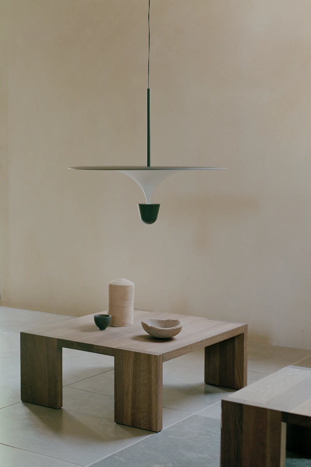 New Works Tenon Side Table, a contemporary solid wood side table featuring a robust, block-like rectangular form crafted from natural medium-brown wood with visible grain.