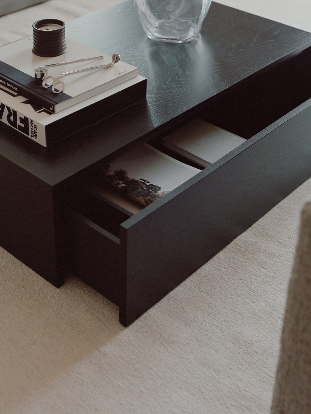 New Works Mass Coffee Table w. Drawer, a modern minimalist coffee table crafted from black stained wood with a subtle visible grain and a smooth matte finish, featuring a sleek rectangular silhouette and an integrated storage drawer.