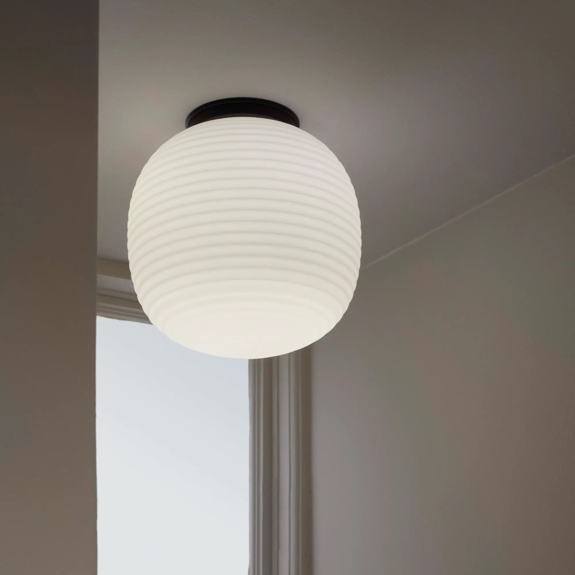 Modern black metal lantern ceiling lamp with intricate cutout design