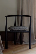 Sleek Bukowski Chair with polished chrome frame and black leather seat