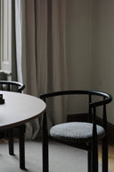 Bukowski Chair in luxurious green satin with ornate silver legs