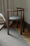 Stylish Bukowski Chair with tufted back and velvet upholstery in emerald green