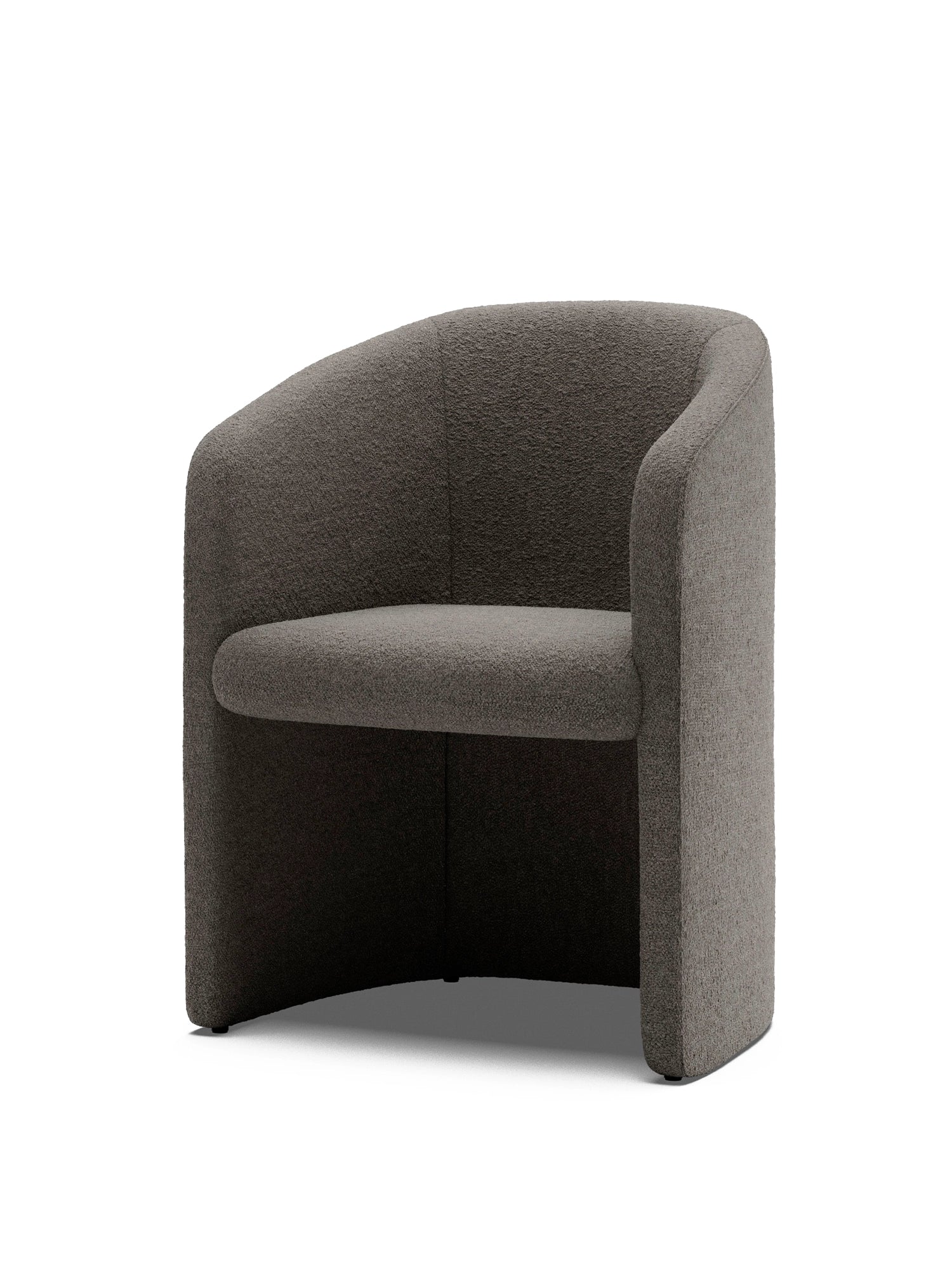 New Works Covent Club Chair, a modern barrel chair with a curved back and armrests, upholstered in luxurious dark grey boucle fabric on a white background. Ideal for a contemporary living room.