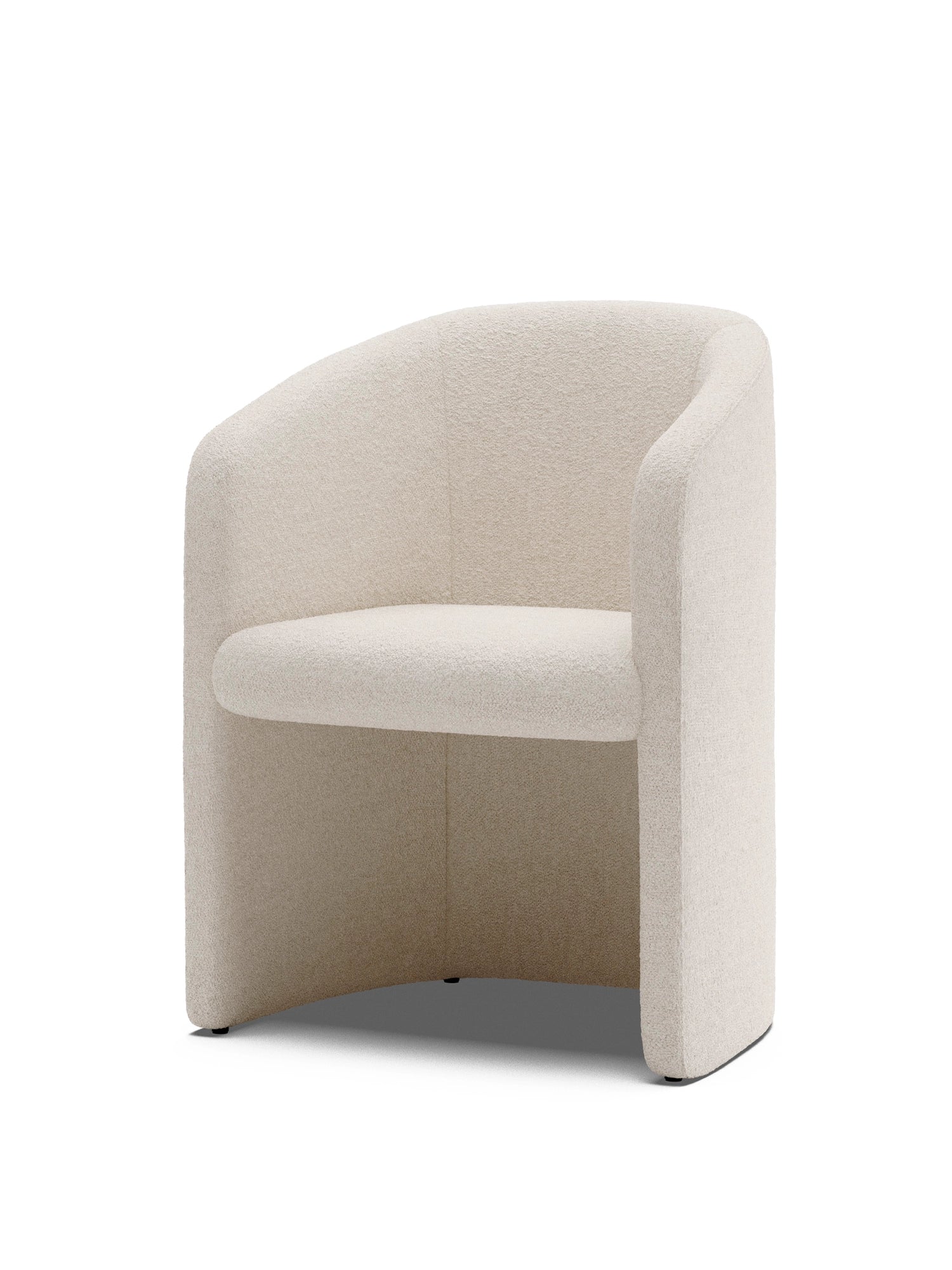 New Works Covent Club Chair in a soft, textured off-white bouclé fabric, featuring a rounded backrest, integrated armrests, and a low profile. This premium, contemporary club chair is ideal for modern living spaces.