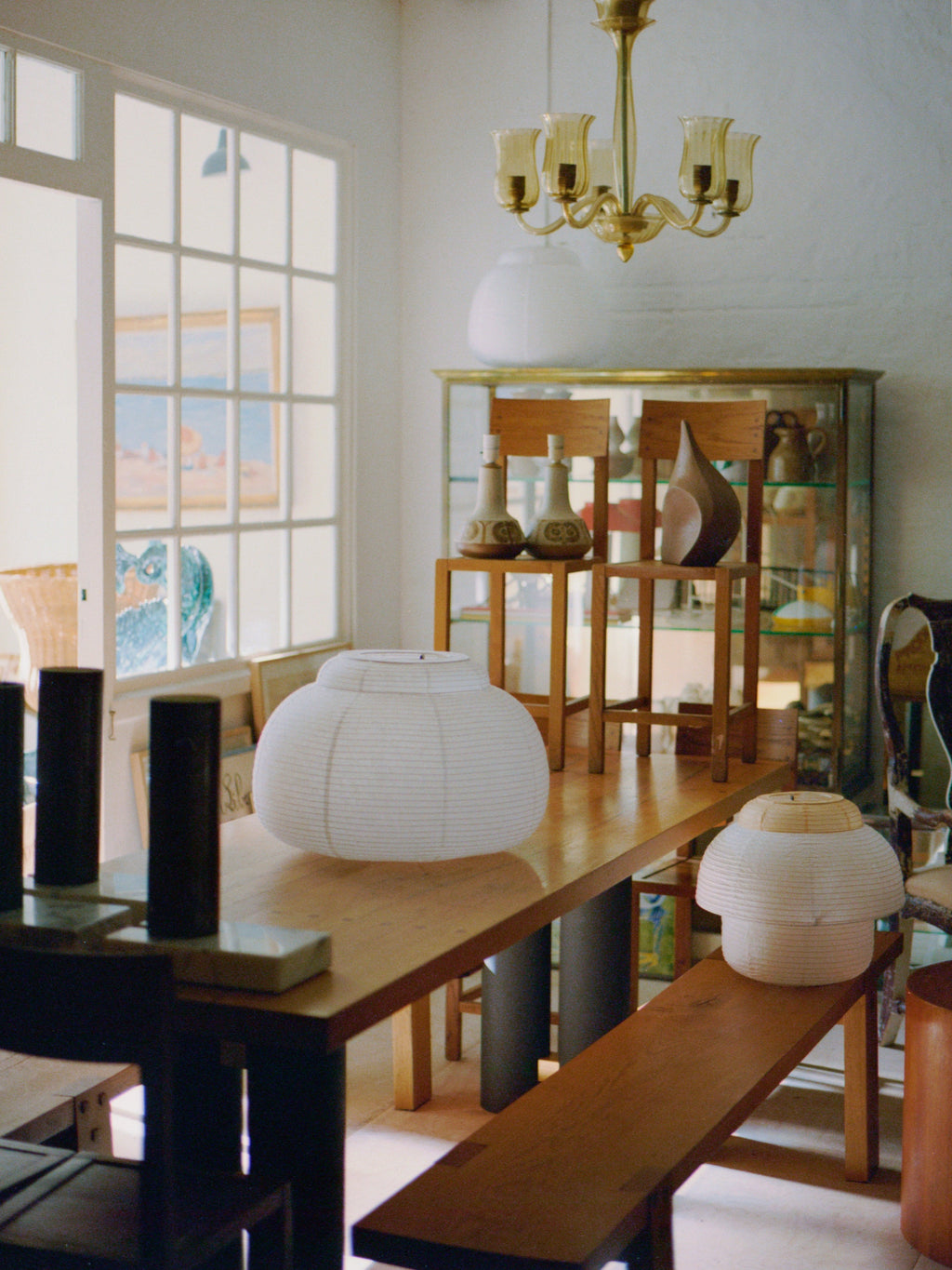 Made by Hand Papier Double Ø40 Pendant Lamp, a minimalist Scandinavian paper lantern featuring a delicate white Washi paper shade with a ribbed texture and a flattened spherical, Akari-style silhouette. This organic modern ceiling light, accented with natural light wood rings, provides soft ambient illumination for Japandi living rooms, peaceful bedrooms, or contemporary dining spaces.