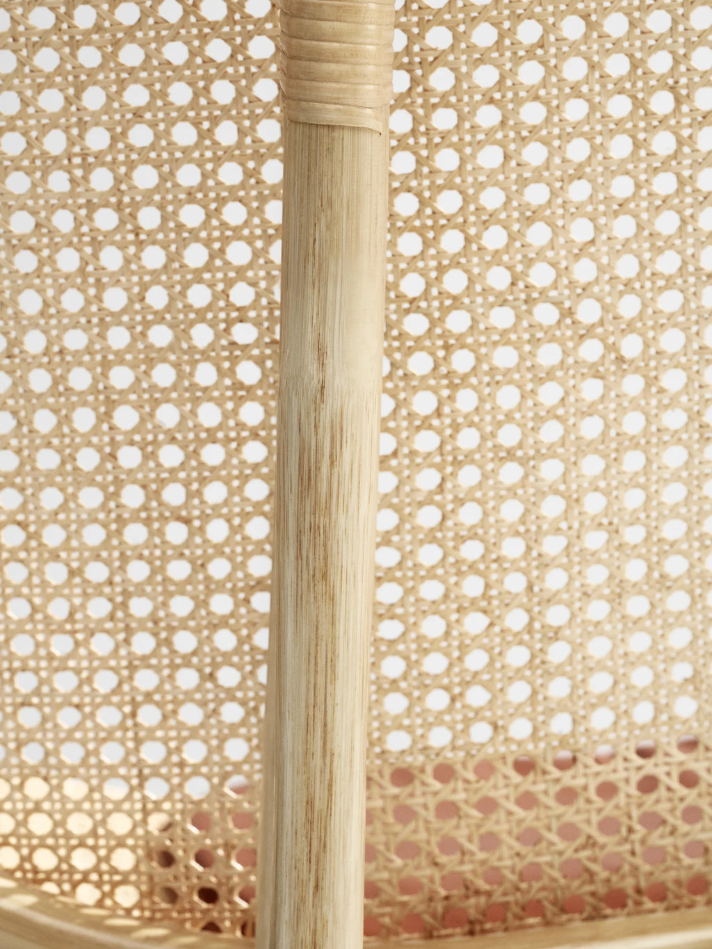 NORR11 Nomad Chair, a premium lounge chair featuring a natural, light-wood cane webbing backrest and a sturdy, light-bamboo frame. This elegant, handcrafted piece brings a touch of modern warmth to any living space, perfect for those seeking durable and stylish furniture.