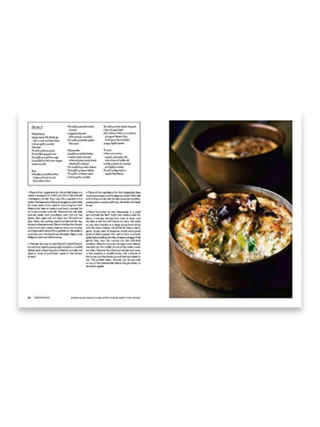 Book Nopi Cookbook, an open culinary book displaying a recipe page with crisp white text and a vibrant food photograph of two rustic copper pans filled with baked vegetable gratin with a golden-brown crust. This cookbook is perfect for home chefs and cooking enthusiasts seeking inspiring, gourmet recipes.