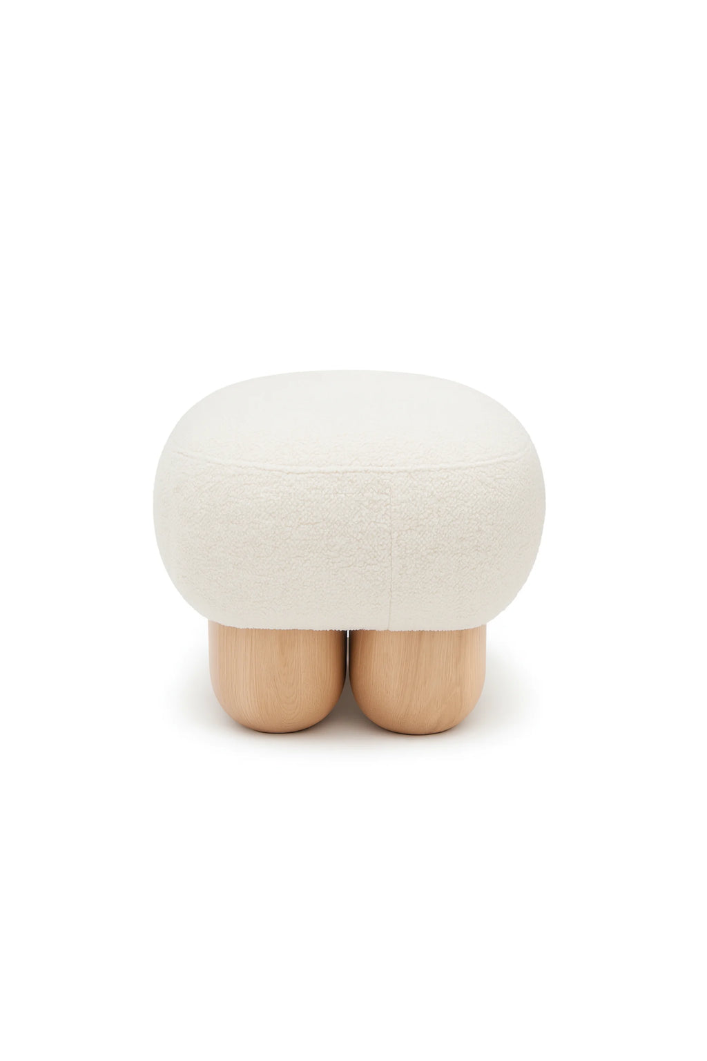 NG DESIGN Object 049 Pouf, an oval-shaped, cream-white bouclé texture luxury pouf, styled on three light natural wood, rounded pill-shaped legs. Perfect for modern living spaces.