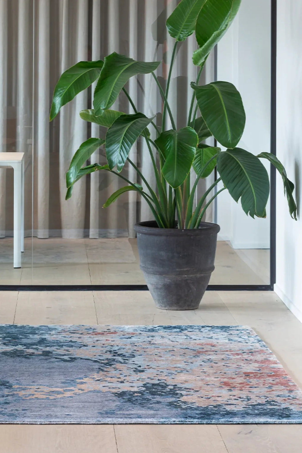 Large rectangular ocean-themed rug with shades of blue and green