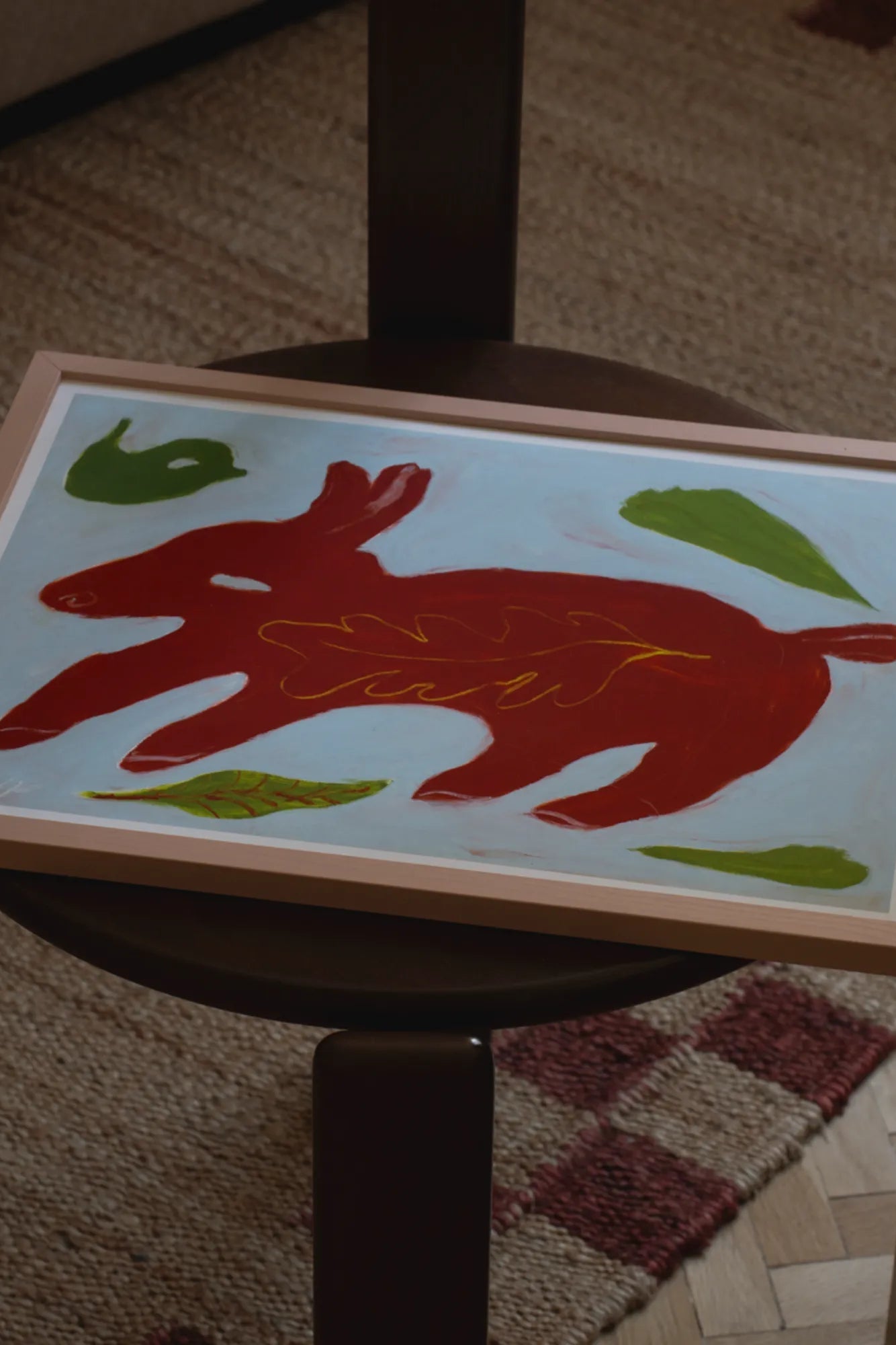 Beautiful red animal and little bird playing in the green meadow 