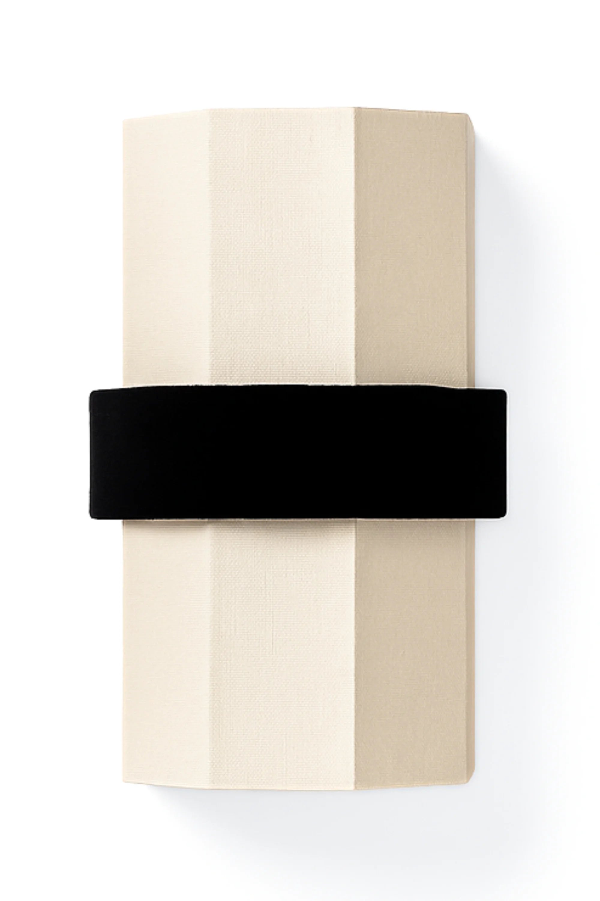 Folded beige fabric with a black band on a white background