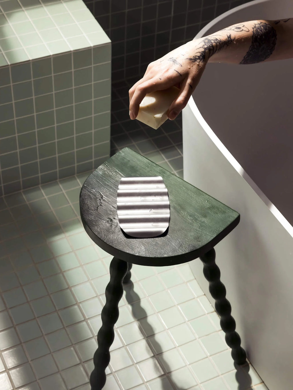 noo.ma Olbi Soap Dish, a sleek and durable brushed stainless steel soap dish with a modern minimalist design and a ribbed surface for optimal soap drainage.