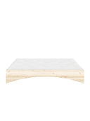 Orbit Bed Karup Design. Wooden bed frame with a white mattress on a white background