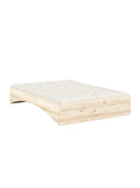Orbit Bed Karup Design. Wooden bed frame with a white mattress on a white background