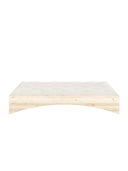 Orbit Bed Karup Design. Wooden bed frame with a white mattress on a white background