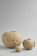 Orimono Vase - Medio placed on a shelf with other decorative items
