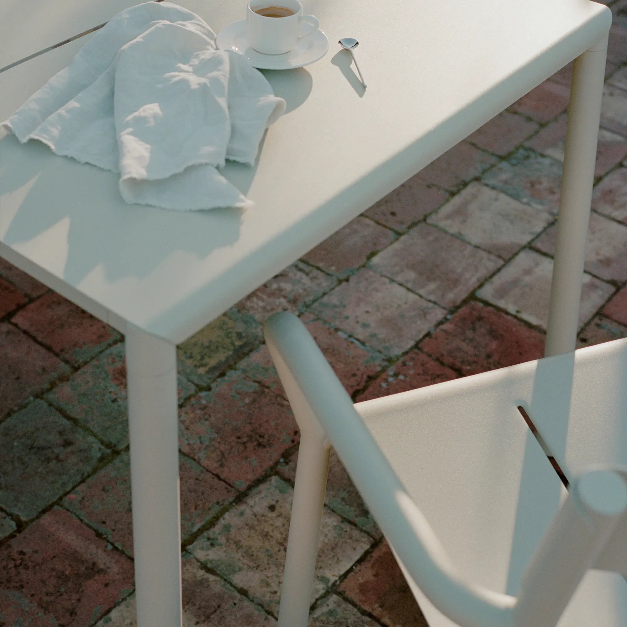 Outdoor May Table with umbrella and colorful tableware
