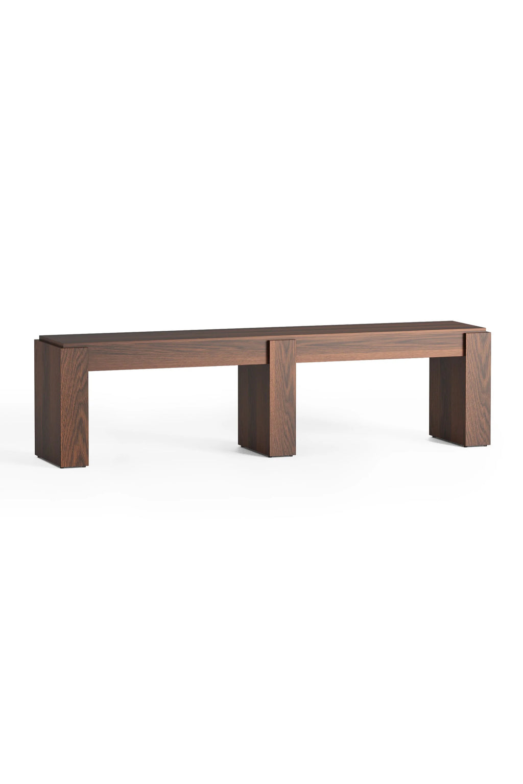 TAMO Pura 160 Bench in a minimal studio shot. This sleek, modern furniture piece is constructed from rich, dark brown wood with visible grain texture. A unique interlocking design forms the base. Ideal for stylish entryway seating or as a contemporary accent piece.