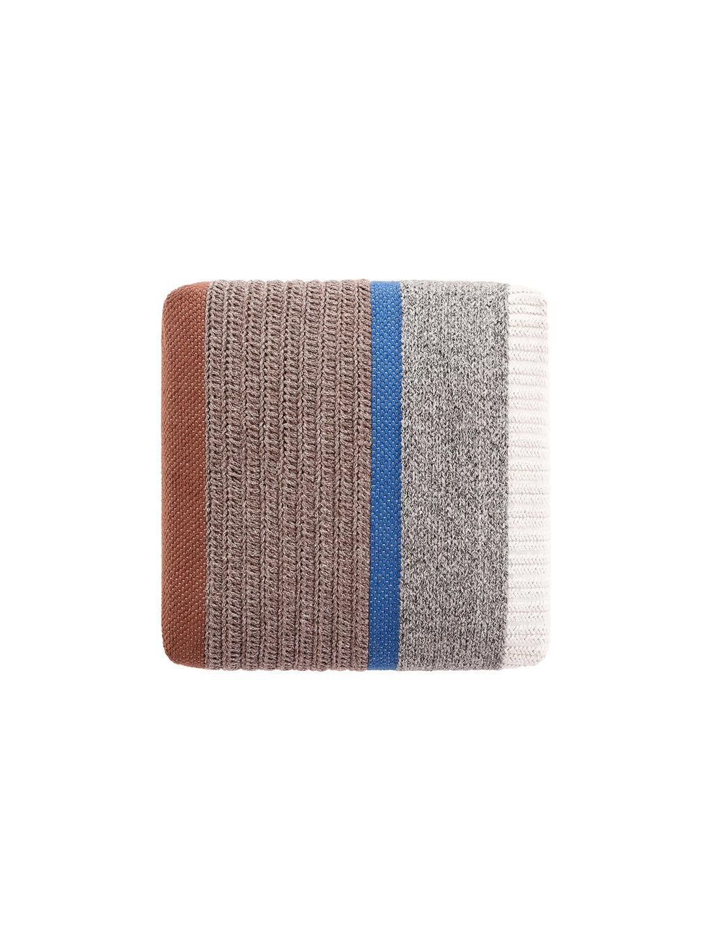 GAN Rugs Mangas Outdoor Pouf - Multicolor, a modern rectangular pouf featuring a chunky knit textured fabric in vertical stripes of warm rust, earthy taupe, vibrant blue, heather grey marl, and soft cream. This cozy woven outdoor pouf offers versatile extra seating or a comfortable footrest with its durable design. Perfect for contemporary patio decor, balcony styling, or a boho chic outdoor living room.