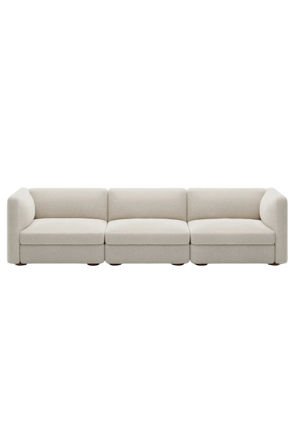 New Works Coda 3-Seater Sofa Configuration 4, a contemporary modular sofa upholstered in plush cream bouclé fabric with a soft, textured finish and a low-profile design. This modern minimalist 3-seater sofa features gently rounded arms and subtle dark wood feet, offering a clean aesthetic.