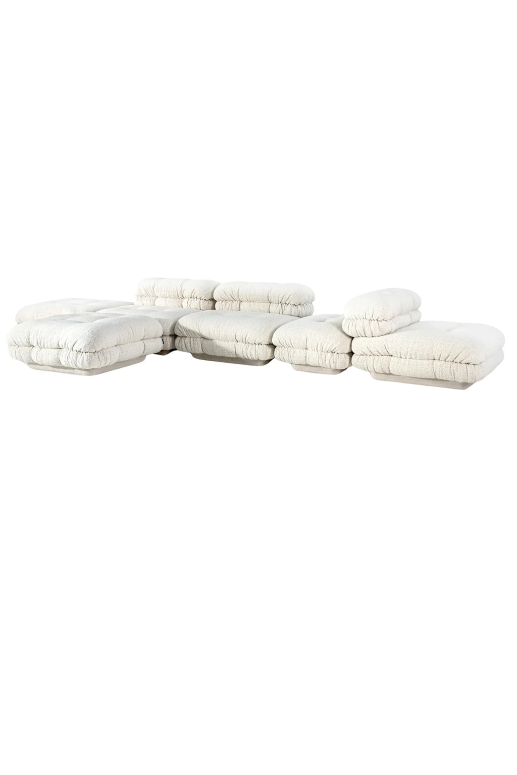 Hessentia Lowell Modular Sofa, an off-white bouclé upholstered modular sofa featuring a low-profile design with plush, deep-seated cushions and distinctive gathered fabric detailing on each segment.