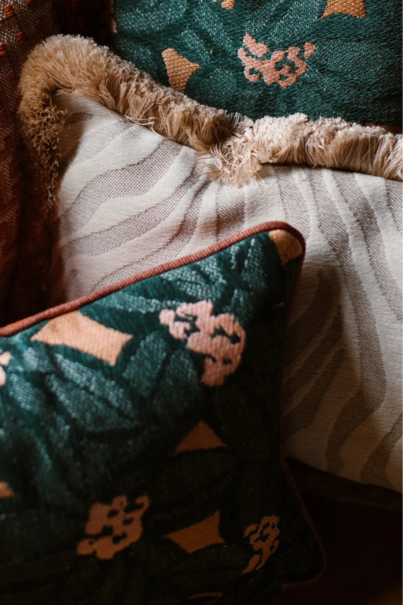  Amina Cushion with Frills displayed on a sofa, creating a cozy and inviting atmosphere 