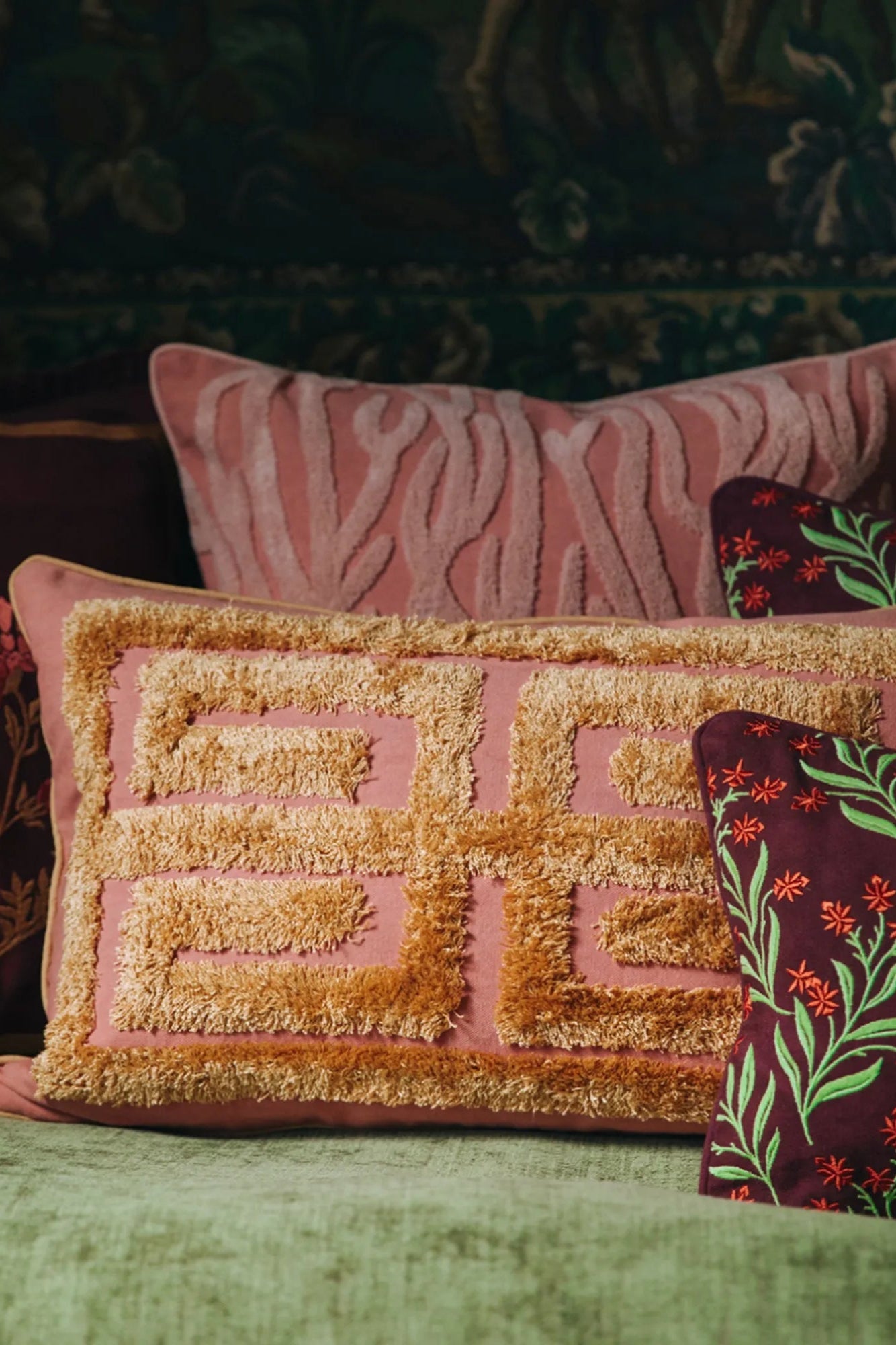 Cleo Cushion featuring a bold floral design in shades of blue and green