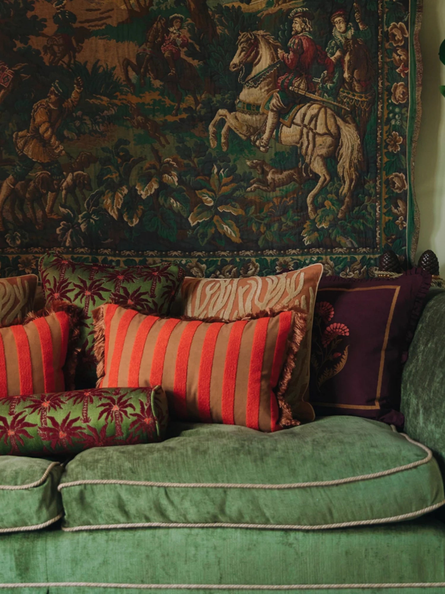 Palais Jackie Throw Pillow, a vibrant rectangular accent cushion featuring bold terracotta orange and warm beige vertical stripes with playful fringed edges. Crafted from a soft woven fabric, this decorative pillow adds a rich, eclectic touch to any space. Ideal for maximalist living rooms, bohemian bedrooms, or grandmillennial-inspired interiors.