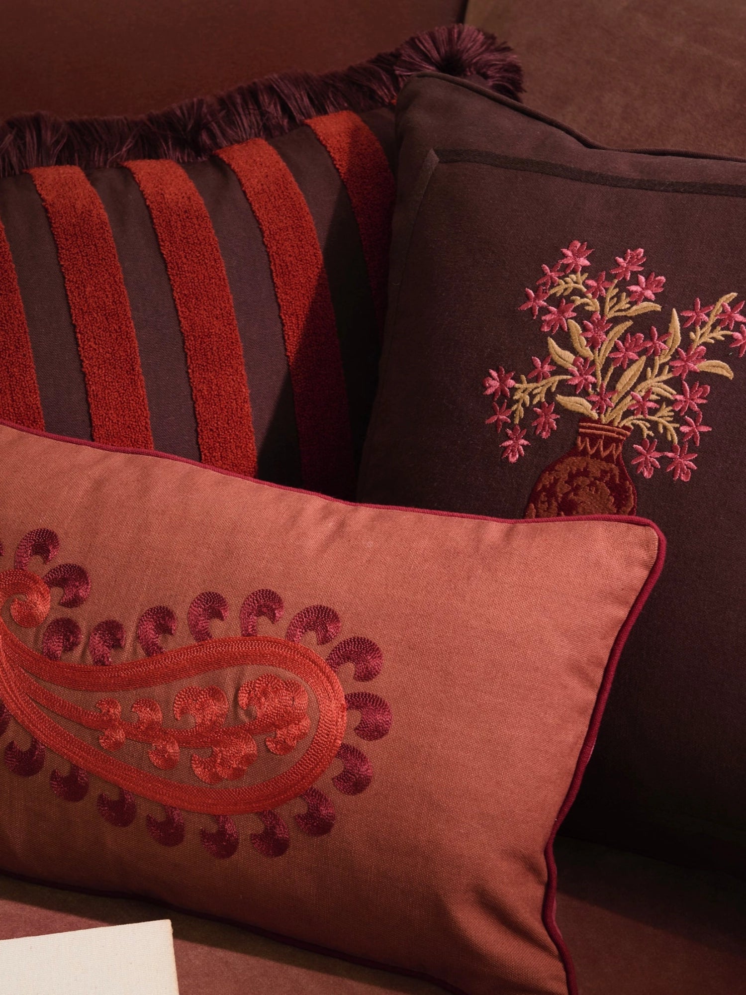 Palais Double Sided Siena Throw Pillow, a luxurious decorative cushion designed with rich terracotta, deep brown, and burnt orange hues, featuring ornate embroidery and plush textures.