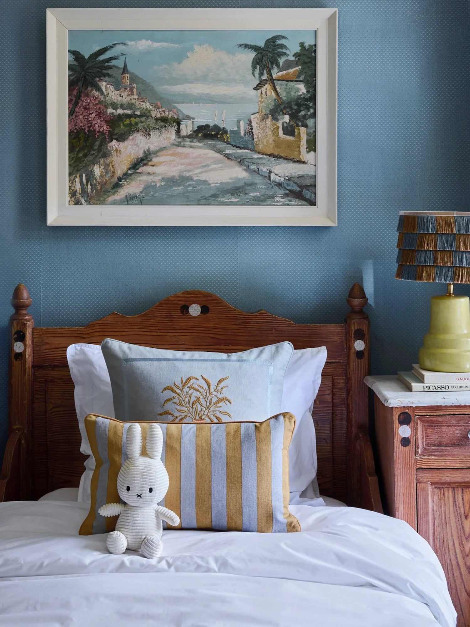 Palais Double Sided Siena Throw Pillow, a rectangular decorative cushion featuring a vibrant mustard yellow and light blue striped design on one side, and delicate gold wheat ear embroidery on a soft blue background on the reverse. Crafted from a textured woven fabric, this versatile accent pillow adds rustic Mediterranean charm or coastal elegance to any bedroom, living room, or nursery.