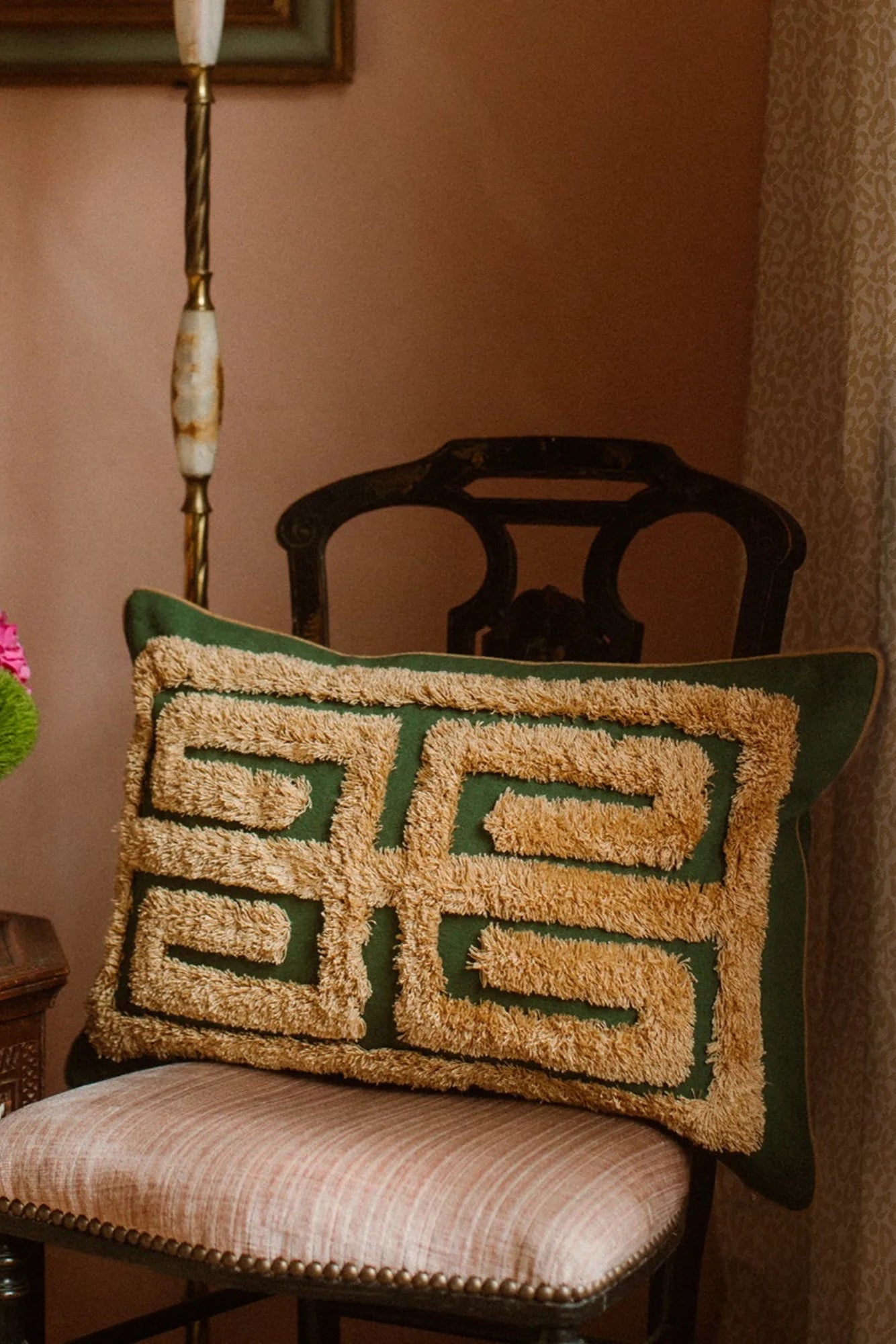 Decorative Cleo cushion cover with intricate floral pattern in soft, muted tones
