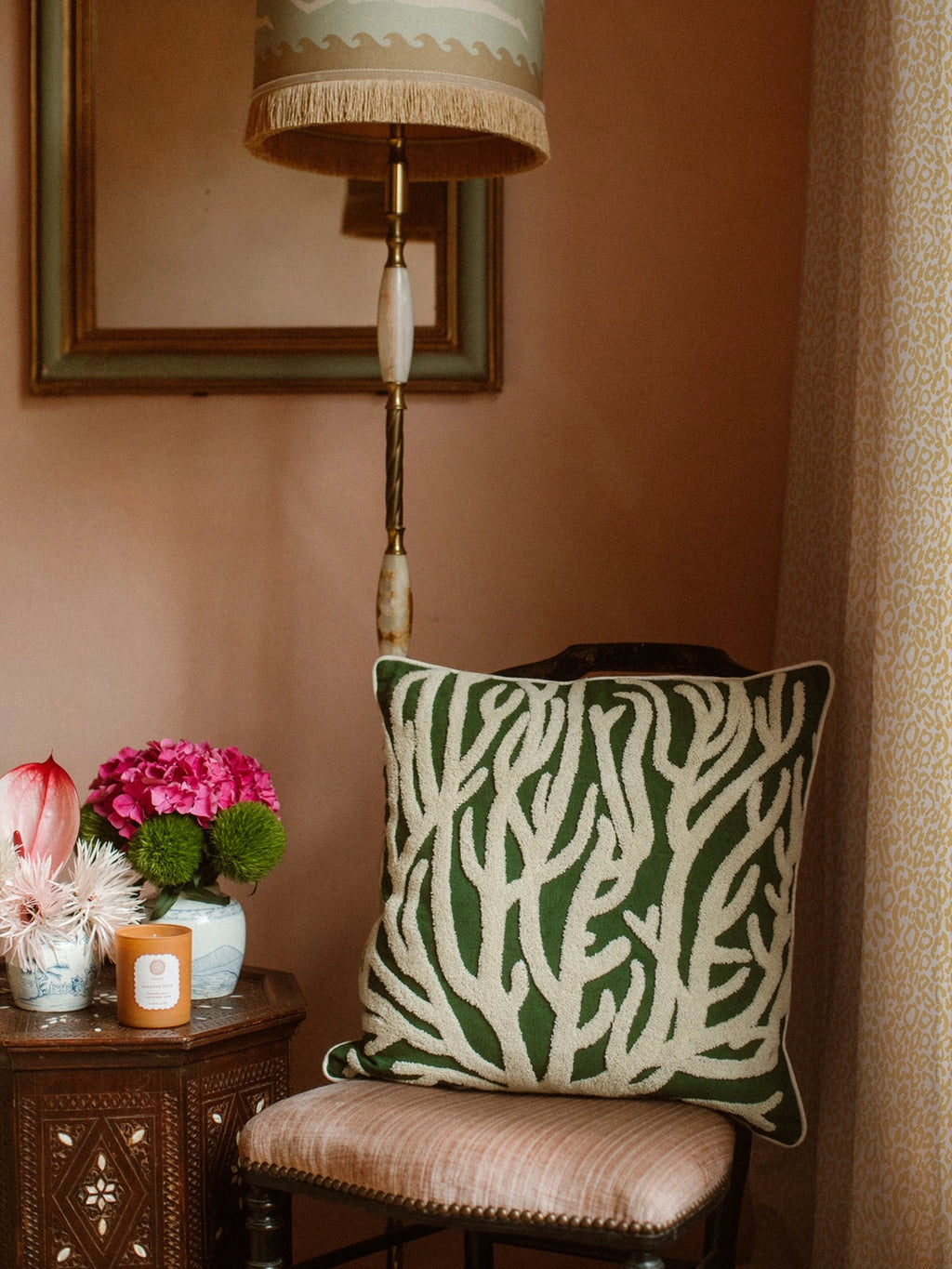 Palais Lauren Throw Pillow, a square decorative cushion featuring a vibrant deep green background with an intricate off-white organic coral-like embroidered pattern and crisp piped edges.