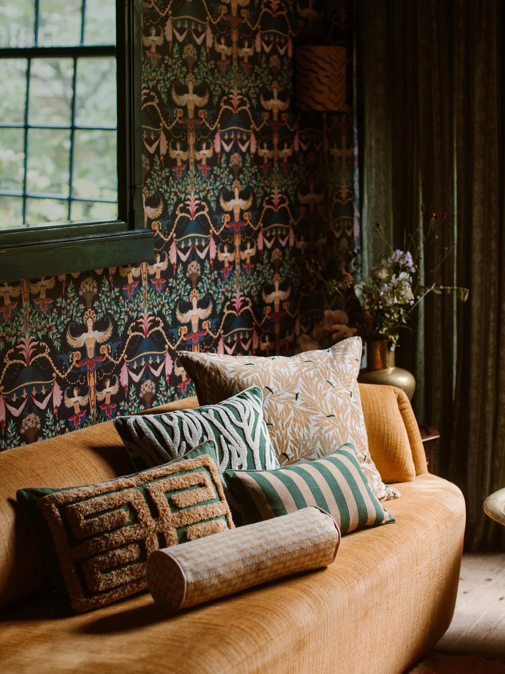 Palais Lauren Throw Pillow, a rectangular deep green accent pillow featuring a prominent raised tan geometric pattern with a plush, textured finish. This contemporary decorative cushion adds an inviting tactile element to living room sofas, eclectic bedroom decor, or boho-inspired lounge spaces.