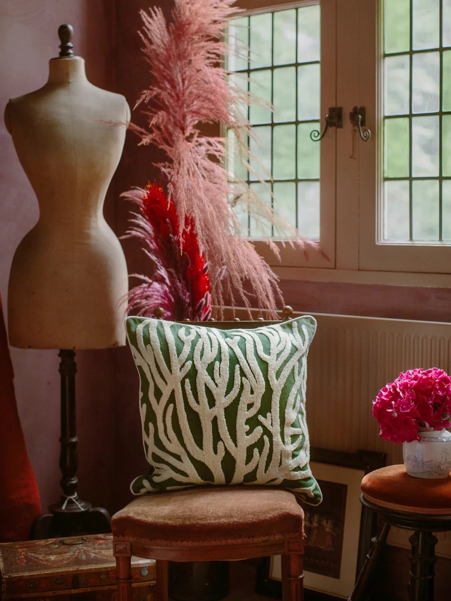 Palais Lauren Throw Pillow, a luxurious deep forest green velvet cushion featuring a striking off-white raised coral pattern with a soft, textured finish. This square embroidered throw pillow brings an organic, coastal-inspired touch to any space. Perfect as a decorative accent for living room sofas, bedroom decor, or bohemian-style chairs.