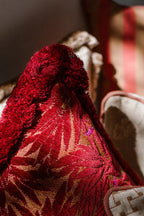 Yoko Bolster Pillow in magenta, adds a touch of luxury to your seating area